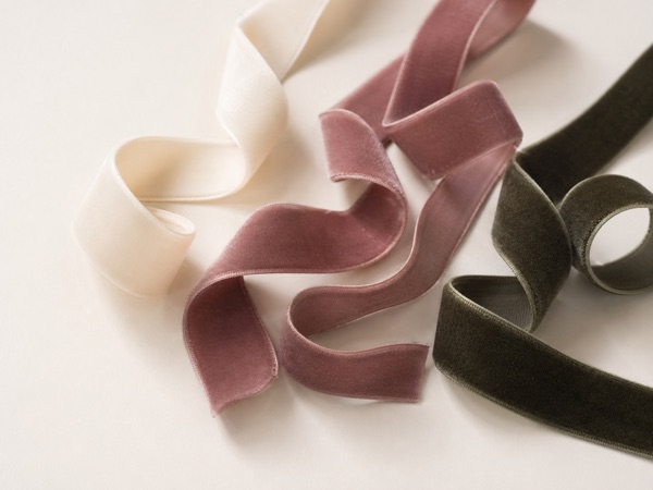 Plush velvet ribbons in ivory, muted rose, taupe, and deep green.